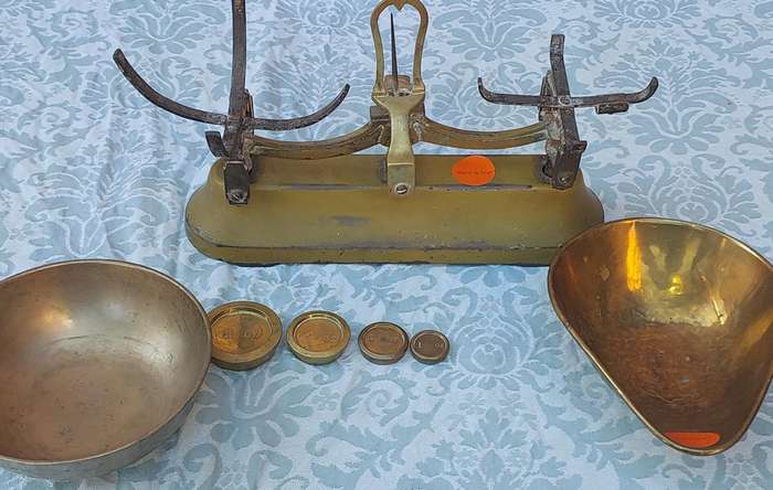 A VINTAGE CAST IRON AND BRONZE SCALE WITH THE BRONZE WEIGHTS SOLD AS IS