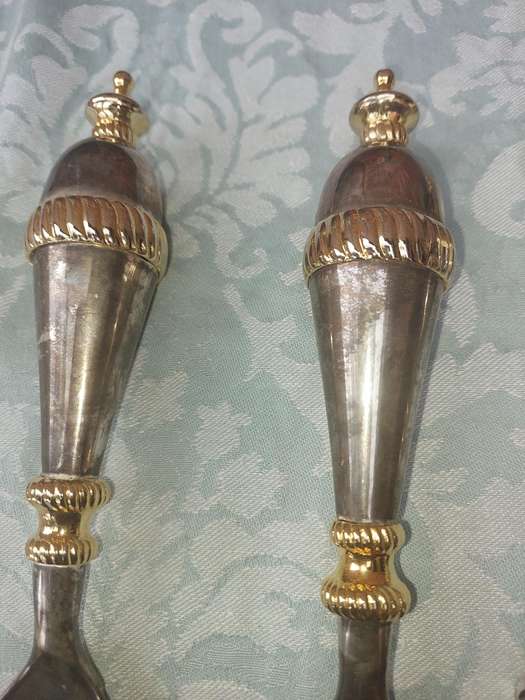 A SET OF ART DECOR STAINLESS STEEL AND BRASS SERVING CUTLERY