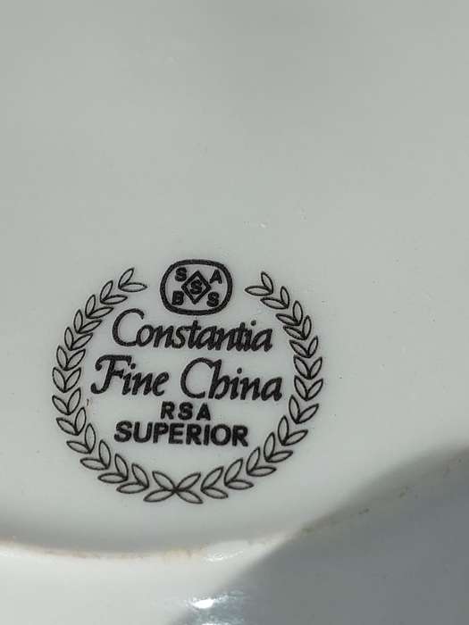A VINTAGE PORCELAIN FINE CONSTANTIA DINNER PLATE SET SABS STAMPED SOLD AS IS