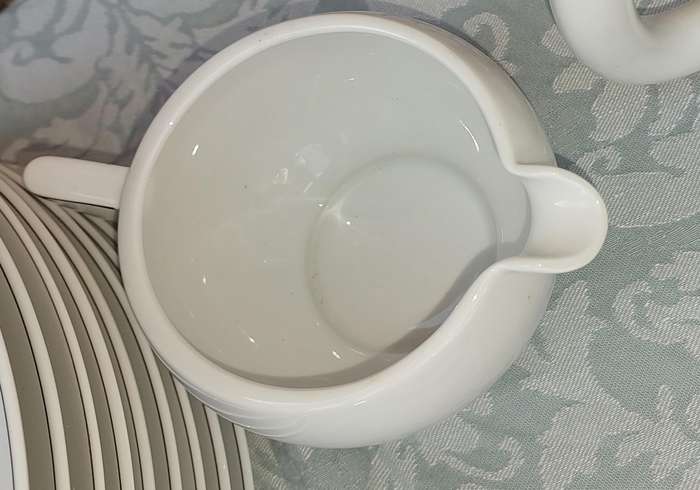 A VINTAGE 47 PIECE WHITE PORCELAIN SET MADE BY ARZBERG GERMANY SOLD AS IS