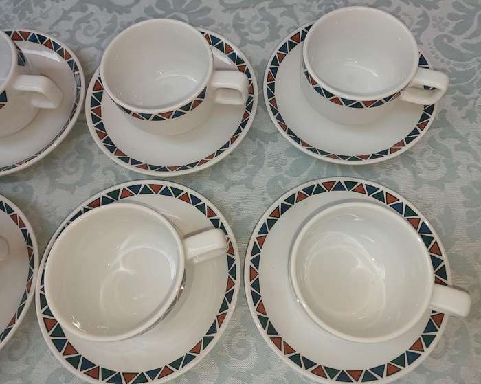 A SET OF CUPS AND SAUCERS BY ROYAL PORCELAIN KINGDOM OF  THAILAND SERIES 02 SOLD AS IS