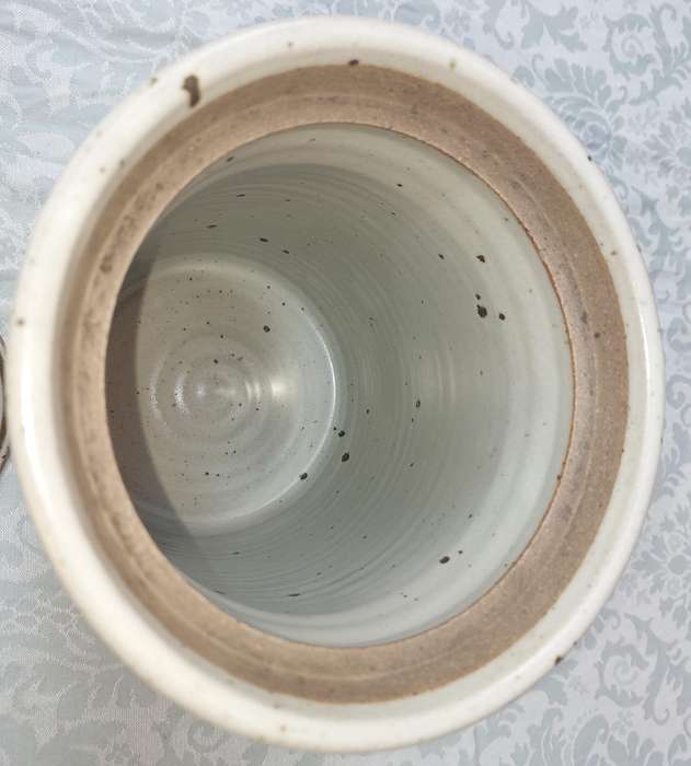 A CERAMIC POTTERY OLIVE JAR WITH A LID SOLD AS IS