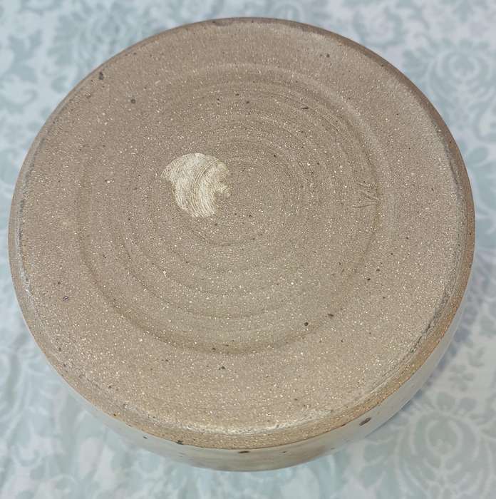 A CERAMIC POTTERY OLIVE JAR WITH A LID SOLD AS IS
