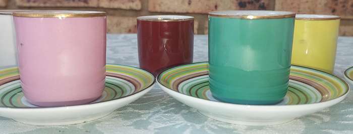 A 17 PIECE DEMATASSE EXPRESSO PORCELAIN CUP AND SAUCER COLECTION SOLD AS IS