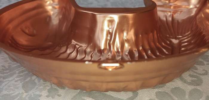 A COLLECTION OIF COPPER BAKING DISHES SOLD AS IS