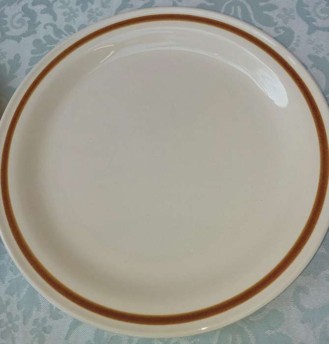 TWO GENUINE STONEWARE VANILLA SPICE PLATES SOLD AS IS