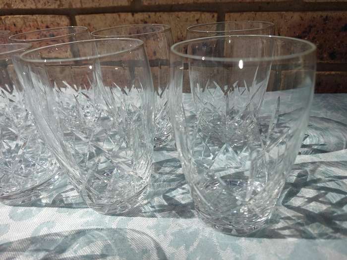 A SET OF 11 CRYSTAL GLASSES SOLD AS IS