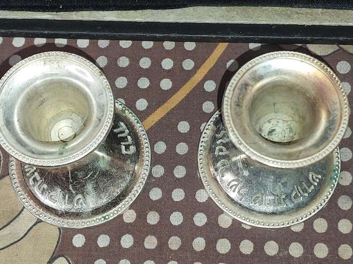 A PAIR OF JUDAICA CANDLE HOLER SILVER PLATED SOLD AS IS