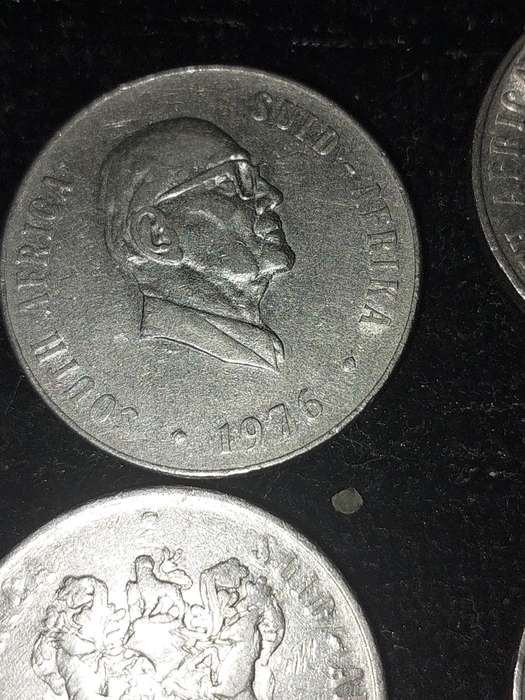 A COLLECTION OF 10 VINTAGE  SOUTH AFRICAN 50 CENTS COINS SOLD AS IS