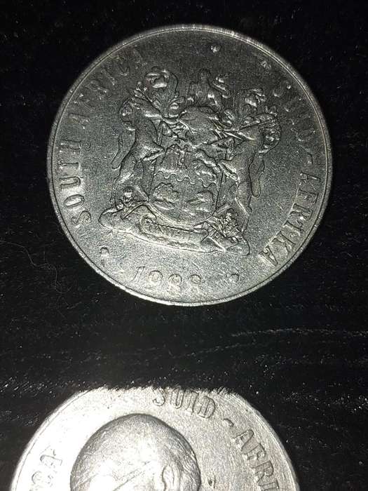 A COLLECTION OF 10 VINTAGE  SOUTH AFRICAN 50 CENTS COINS SOLD AS IS