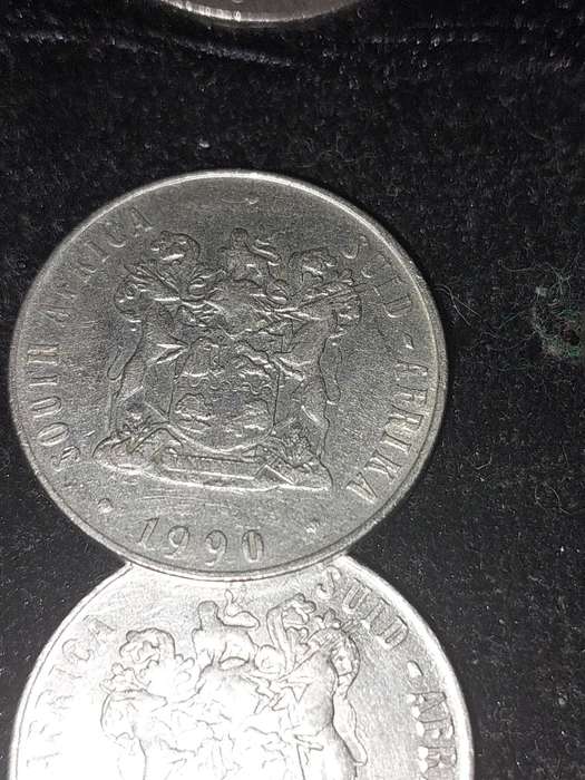 A COLLECTION OF 10 VINTAGE  SOUTH AFRICAN 50 CENTS COINS SOLD AS IS