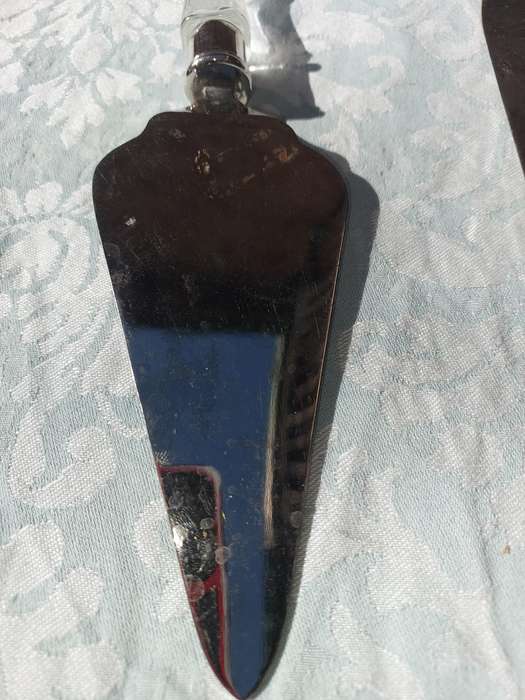 AN ART DECOR CAKE CUTTING SET CUTLERY SOLD AS IS