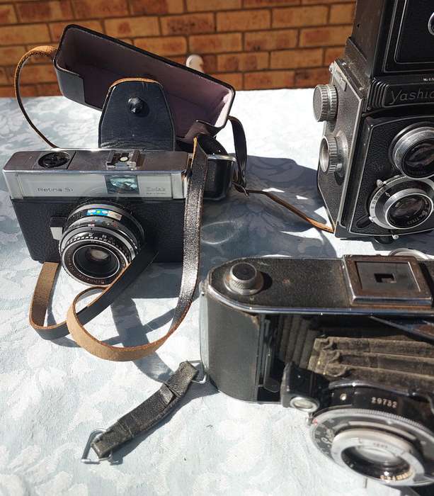 AN ANTIQUE COLLECTION CAMERAS SOLD AS IS