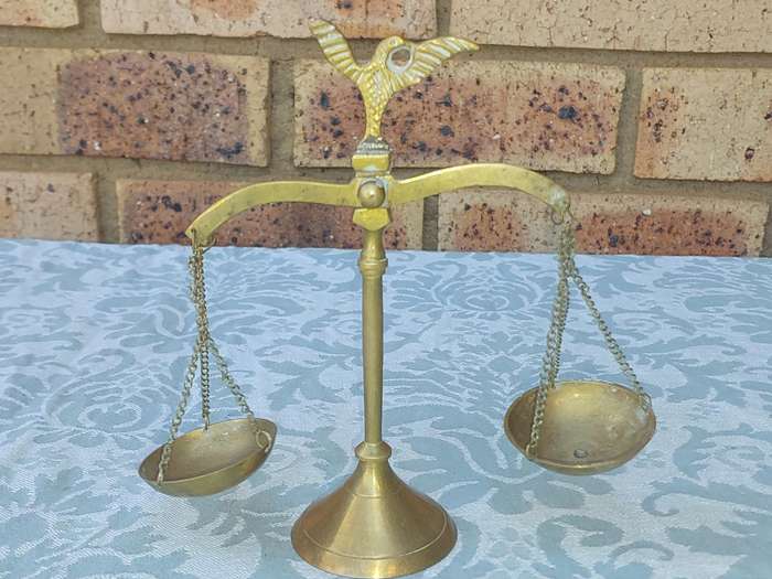 A VINTAGE ART DECOR BRASS ORNAMENTAL SCALE BALANCE SOLD AS IS