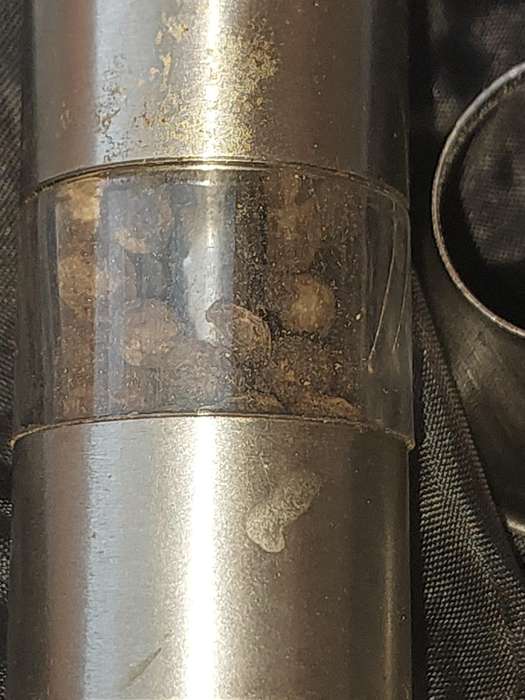 A SET OF STAINLESS STEEL PLUNGER SALT AND PEPPER DISPENSERS