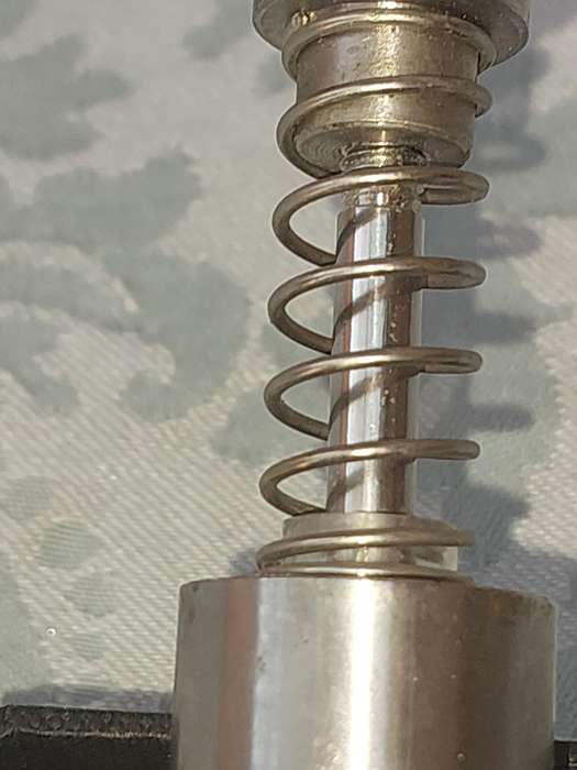 A SET OF STAINLESS STEEL PLUNGER SALT AND PEPPER DISPENSERS