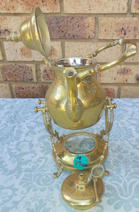 Vintage Brass and Silver Plated Tipping Teapot sold as is