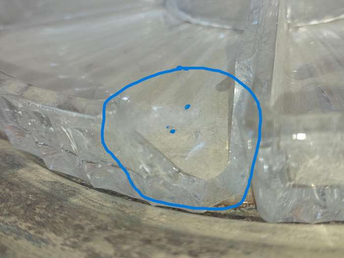 AN ANTIQUE SILVER PLATED WITH HANDLES LAZY SUZAN WITH ONE OF THE GLASS SEGMENT CRACKED SOLD AS IS