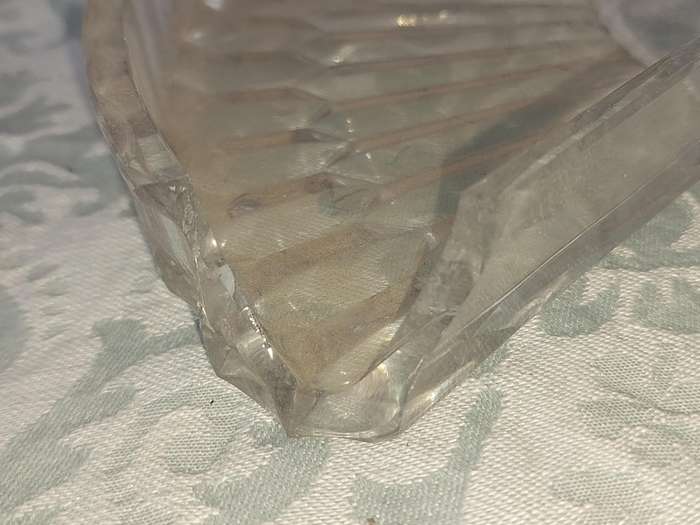 AN ANTIQUE SILVER PLATED WITH HANDLES LAZY SUZAN WITH ONE OF THE GLASS SEGMENT CRACKED SOLD AS IS