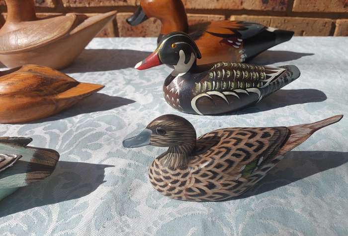 AN ENTIRE COLLECTION DUCK DECOYS AND FIGURINES SOLD AS IS