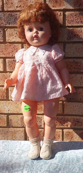 A vintage 70 centimetre doll sold as is
