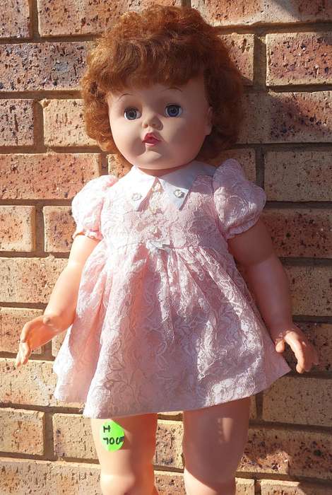 A vintage 70 centimetre doll sold as is