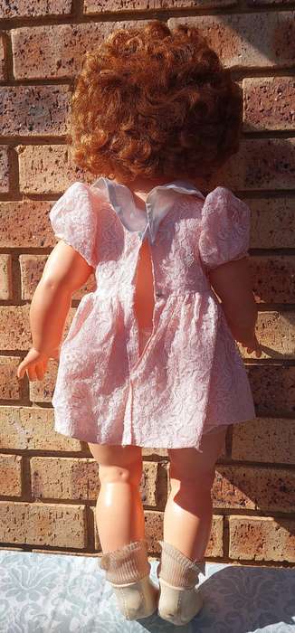 A vintage 70 centimetre doll sold as is