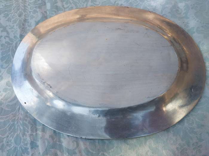 A VINTAGE HAND MADE PEWTEL OVAL SERVING PLATTER SOLD AS IS