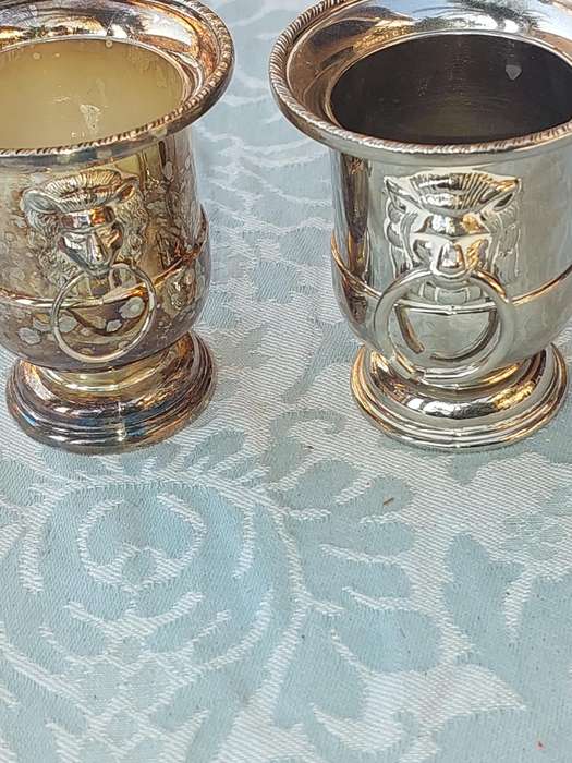 A COLLECTION OF5 LION HEAD TOOTH PIK HOLDERS SOLD AS IS SILVER PLATED