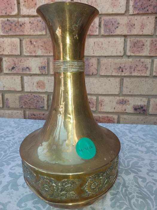 A VINTAGE ORNATE BRASS VASE MADE IN HOLAND SOLD AS IS