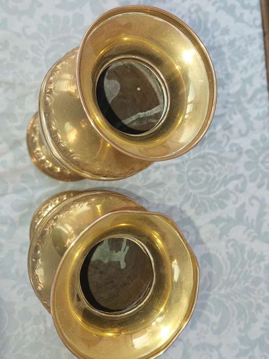 A PAIR OF ORNATE BRASS VASES SOLD AS IS