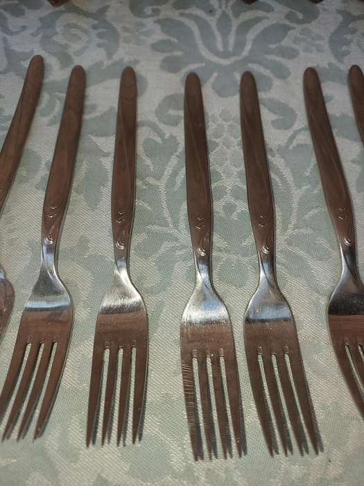 A SET OF VINTAGE GERMAN STAINLESS STEEL CUTLERY SOLD AS IS
