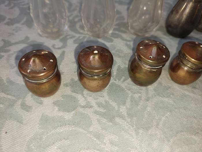 A COLLECTIONOF SALT AND PEPPER DISPENSORS SOLD AS IS