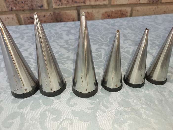 A COLLECTIONOF SALT AND PEPPER DISPENSORS SOLD AS IS