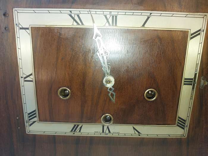 AN ANTIQUE PADESTAL CLOCK WITH THE WINDING KEYS MADE IN ENGLAND AND CHIMES SOLD AS IS