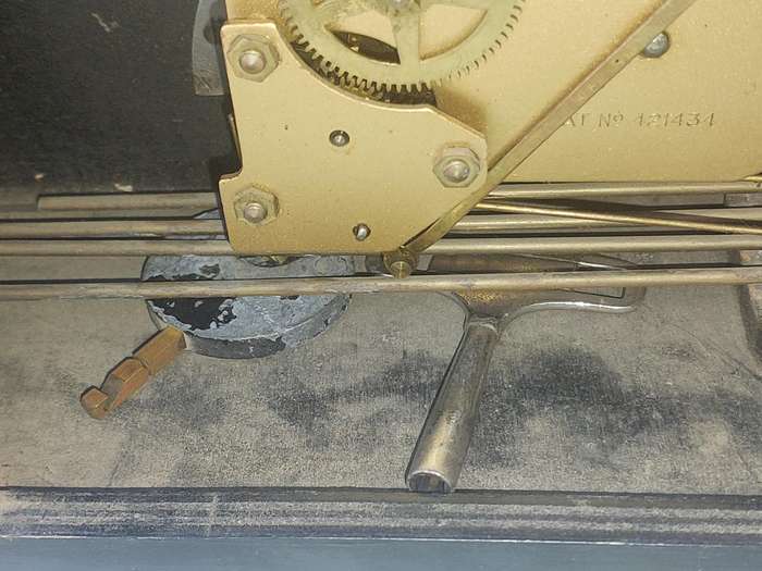AN ANTIQUE PADESTAL CLOCK WITH THE WINDING KEYS MADE IN ENGLAND AND CHIMES SOLD AS IS