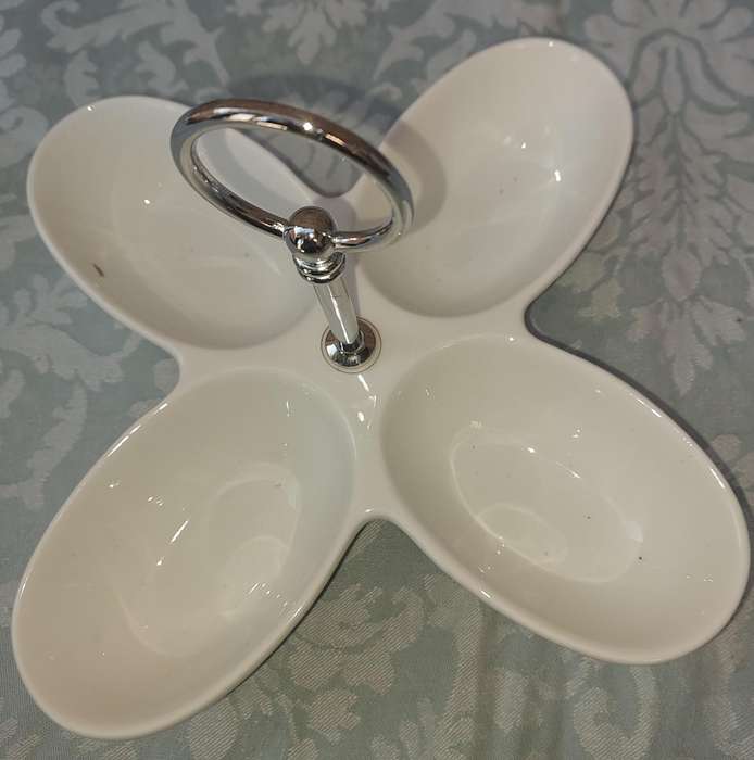 A PORCELAIN FOUR COMPARTMENT SWEET STAND SOLD AS IS