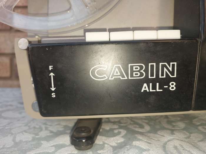AN ANTIQUE MOVIE PROJECTOR WIYHOUT THE POWER CABLE SOLD AS IS NOT TESTED