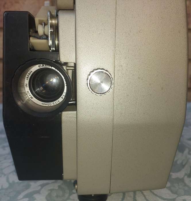 AN ANTIQUE MOVIE PROJECTOR WIYHOUT THE POWER CABLE SOLD AS IS NOT TESTED