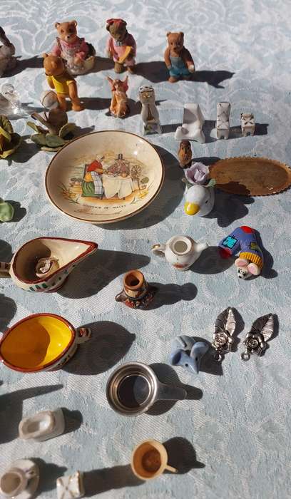 AN ENTIRE COLLECTION PORCELAIN CHARMS AND FIGURINES SOLD AS IS