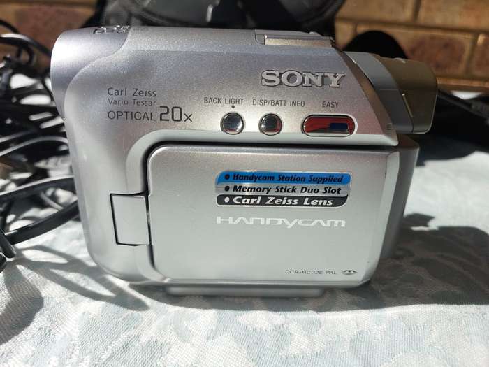 A SONY MODEL DCR-HC32E DIGITAL VIDEO CAMERA RECORDER IN WORKING ORDER WITH ALL CABLES , BATTERY AND
