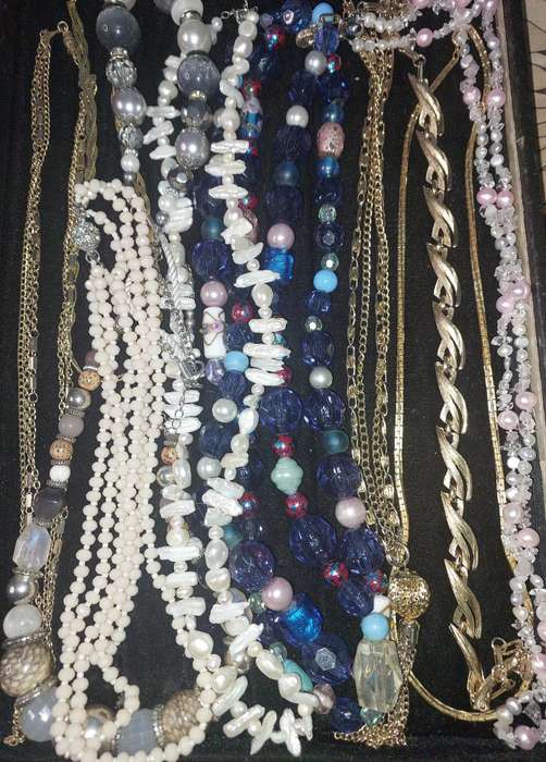 A VINTAGE COLLECTION OF COSTUME NECKLACES SOLD AS IS