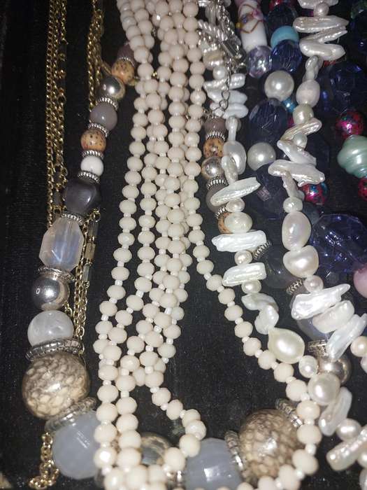 A VINTAGE COLLECTION OF COSTUME NECKLACES SOLD AS IS