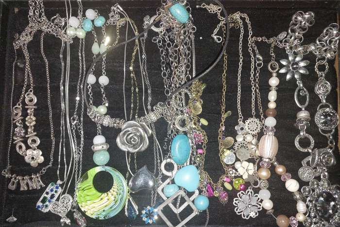A COLLECTION OF DESIGNER COSTUME NECKLACES SOLD AS IS