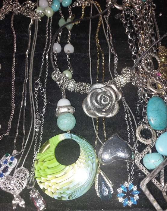 A COLLECTION OF DESIGNER COSTUME NECKLACES SOLD AS IS