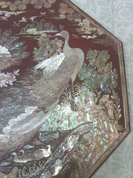 A LACQUER WOODEN JEWELRY BOX WITH WOODEN INSERTS AND A MOTHER PEARL INLAY OF PEACOCKS AND FLORAL IN