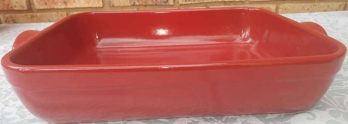 A EMILE HENRY RED CASSEROLE DISH MADE IN FRANCE SOLD AS IS