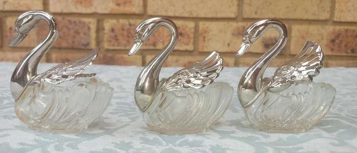 A set of 3 Swan Salt Cellars with out  Spoons Silver Plate vintage sold as is