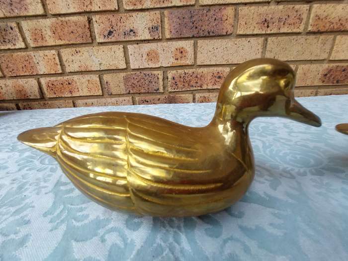 TWO SOLID BRASS DUCKS  SOLD AS IS