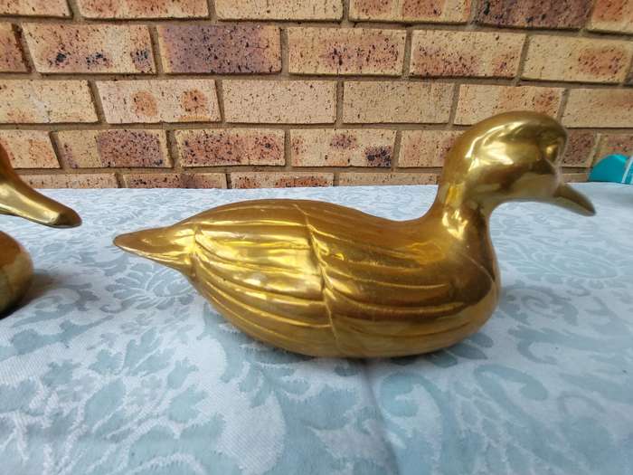TWO SOLID BRASS DUCKS  SOLD AS IS